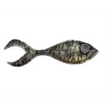 An unusual white metal brooch (probably low grade silver) fashioned as a fish with large tail and