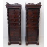 An unusual opposing pair of late Regency period eight-drawer rosewood Wellington chests of slim