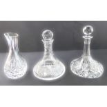 Two cut-glass ship's decanters and a hand-cut vase of baluster form: 1. a ship's decanter,