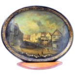 A Victorian hand-painted oval papier-mâché tray: decorated with a town scene and with inlaid