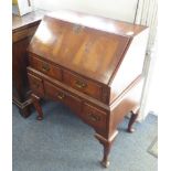 An early 20th century fall-front bureau-on-stand in George I style and of compact proportions: