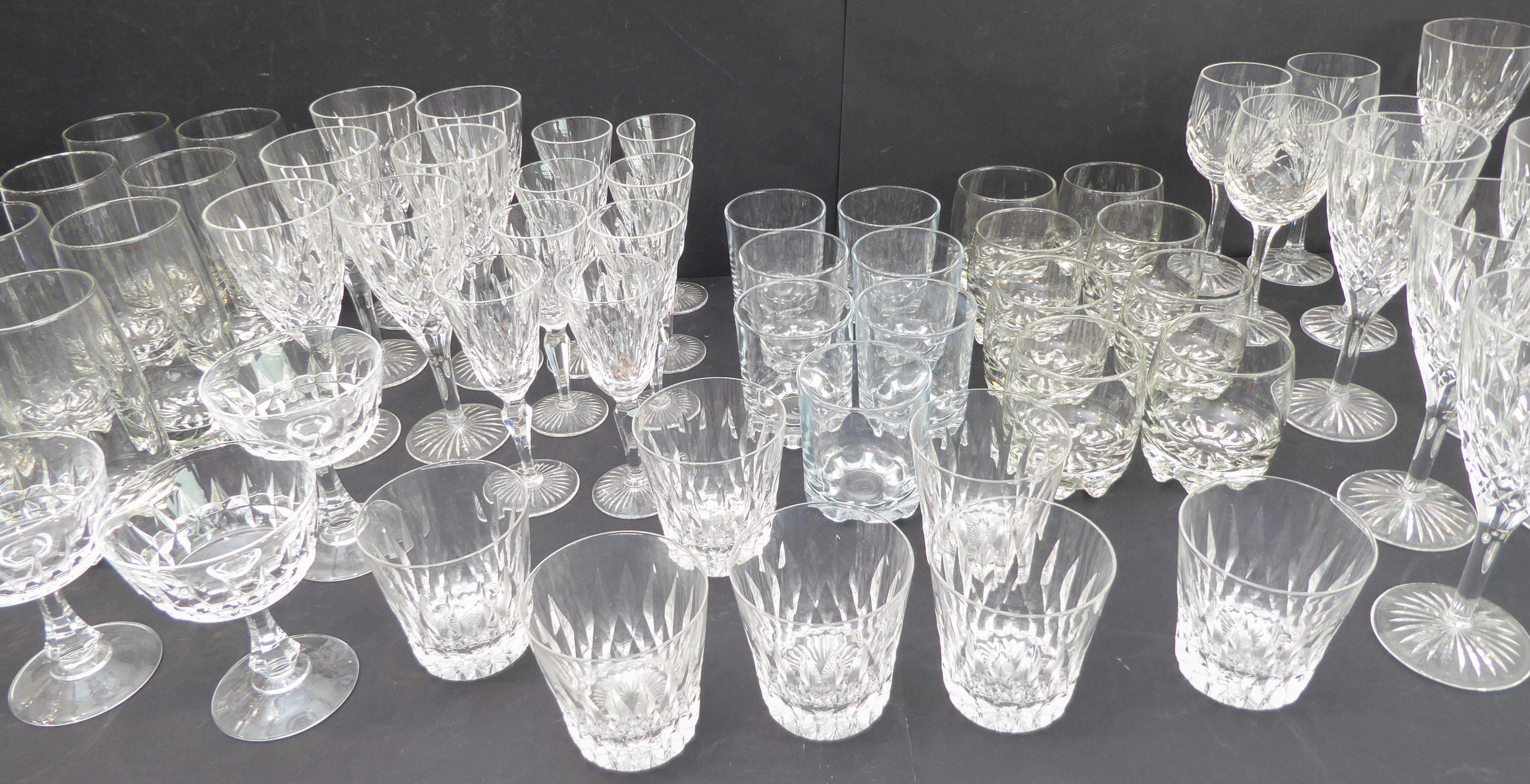 Sets of drinking glasses comprising: Wines: 6 x 19 cm marked 'Stuart'; 6 x 17.5 cm; 8 x 15 cm; 4 x