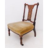 An Edwardian mahogany and boxwood strung open armchair: arched concave top rail above vertical