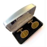 A pair of gentleman's vintage gold-plated and tiger's eye mounted cuff links