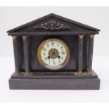A late 19th century black slate eight-day mantle clock of architectural inspiration: cream dial with