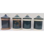 Four Victorian pottery drug jars with lids (28 cm high including lids)