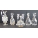 Five quality hand-cut decanters, together with a 19th century style hobnail cut claret jug and a