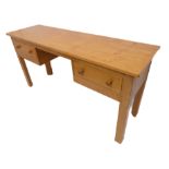 A good modern light oak side table; the slightly overhanging top above kneehole space and two