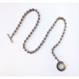A Gucci silver necklace with spherical silver beads and T-bar clasp
