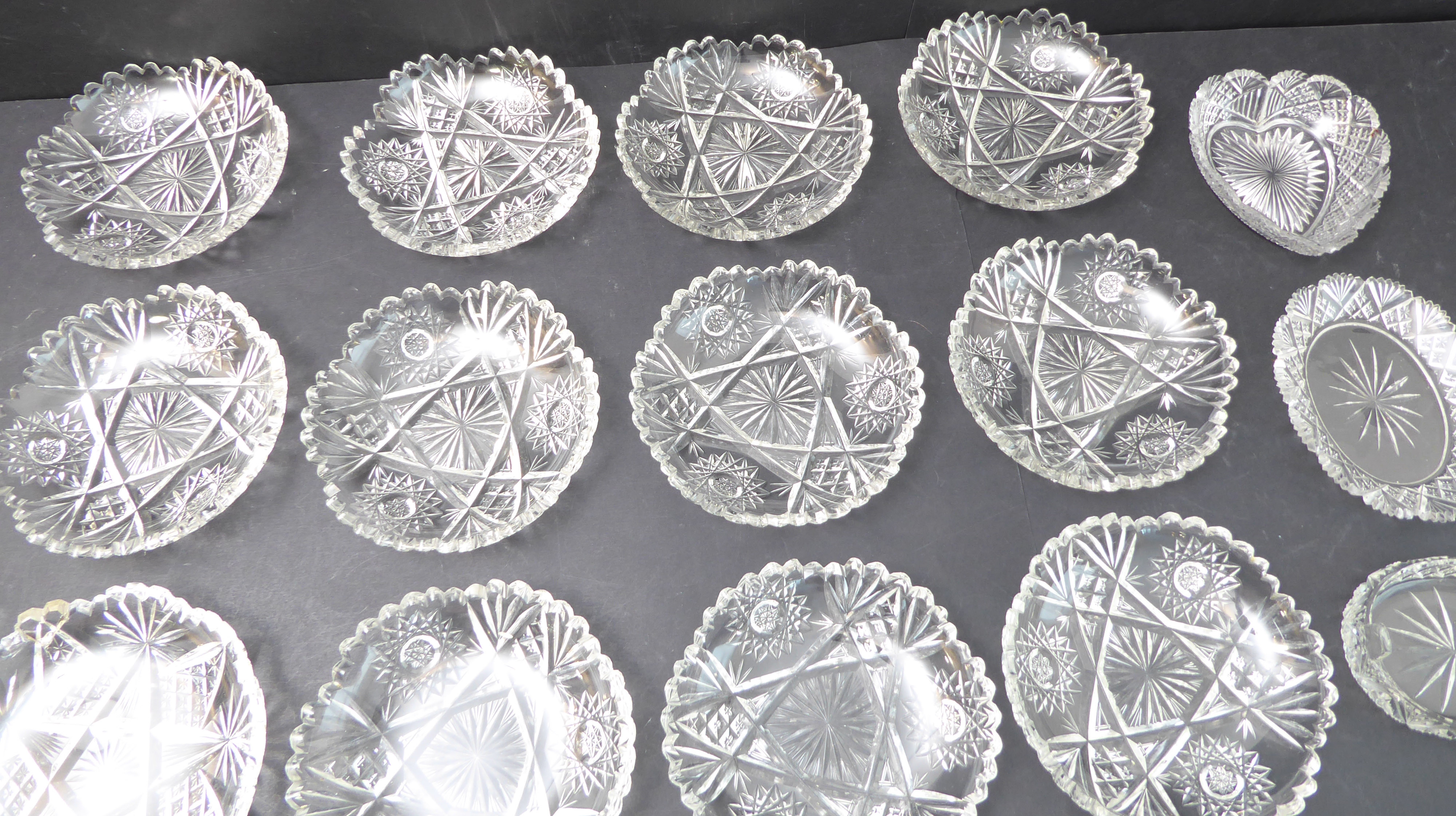 A set of 12 mid-20th century hand-cut Bohemian-style ice bowls (15.5 cm diameter) (one damaged),