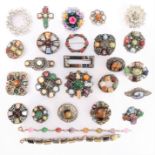 A selection of costume brooches to include a Scottish-style example set with polished hardstones and