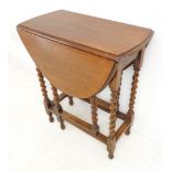 An early 20th century oval-topped oak drop-leaf gateleg table: of small proportions and of nice
