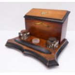 An Edwardian desk-set with lidded stationery box and two original inkwells with red and black tops