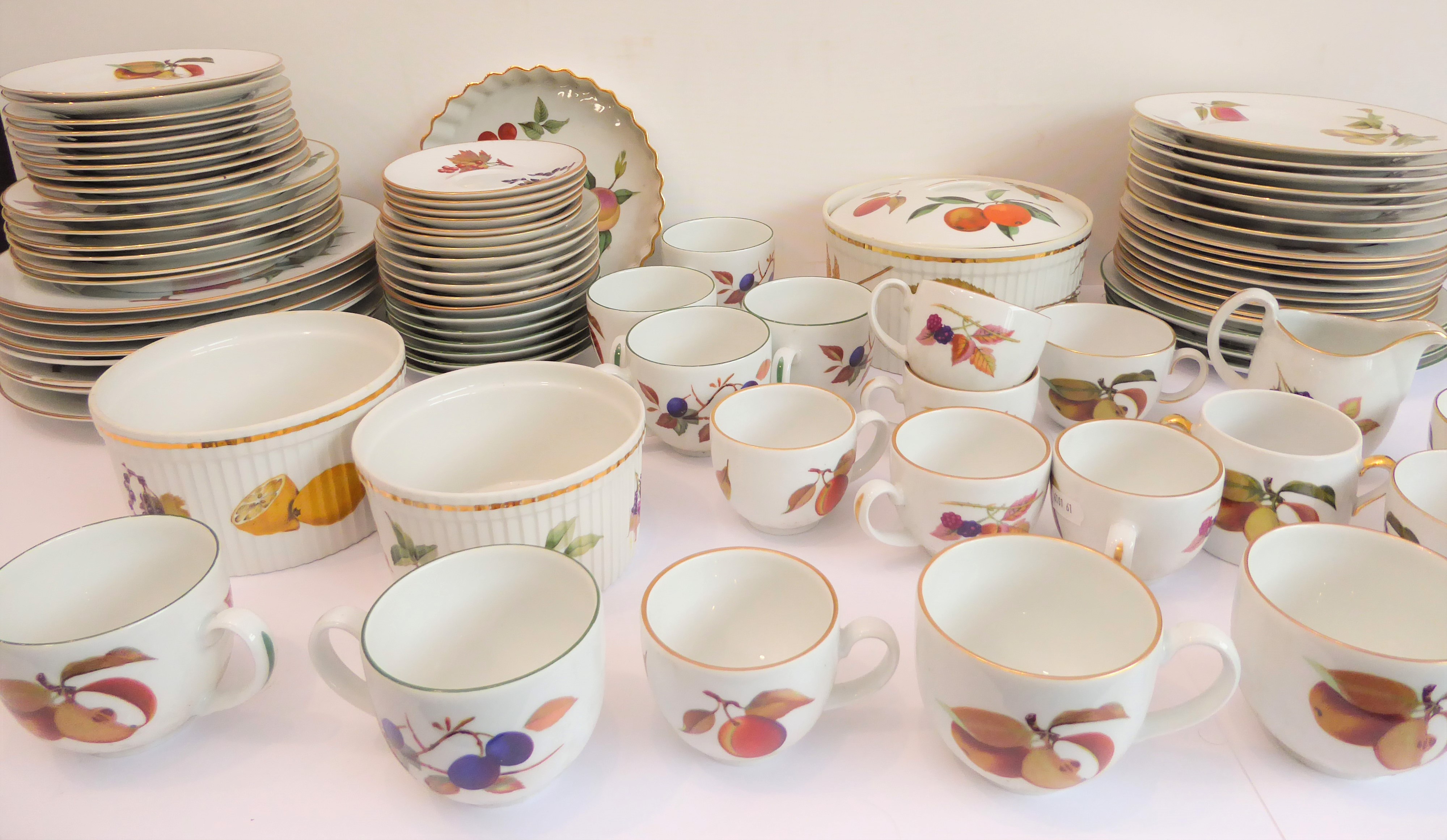 A quantity of Royal Worcester Evesham tableware to include: dinner and side plates, flan dish,