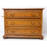 The matching pair of lot 431 - A modern three-drawer cherrywood chest: moulded top above three