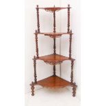 A 19th century four-tier figured walnut whatnot with barley-twist style uprights (115cm high)