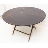 An early 20th century circular folding coaching table (106 cm in diameter)