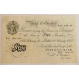 A 1952 'White Fiver' (£5 note), the reverse with the blue stamp of Messrs. Arthur Guinness, Son &