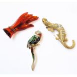 A selection of brooches to include: a 1980s (Attwood Collection) brooch modelled as a parrot