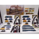 Four boxed Hornby Railway sets (as new) with associated paperwork and booklets (three identical)