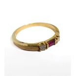 An 18-carat gold ring set with ruby and diamonds, size O