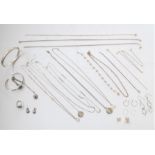 A small quantity of mostly silver jewellery to include: neck chains, a matching bangle, ring earring