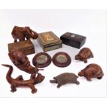 A variety of treen and carved wooden animals to include: an elephant, a lizard, tortoises,