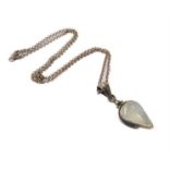 A silver-mounted pendant with an inverted pear-shaped polished moonstone upon a silver chain (