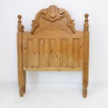 Two pine single bed headboards: one carved with a thistle motif (101cm wide x 132cm high), the other