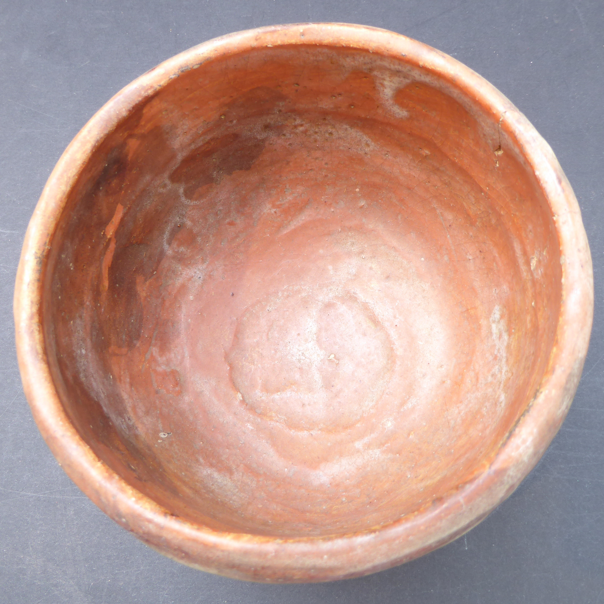 A Japanese pottery tea ceremony bowl in early style and with impressed character mark near foot - Image 4 of 7