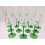 Two sets of wine glasses: a set of six conical flutes with engraved circular decoration and a set of