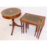 A reproduction mahogany drum-table and a matching nest of three occasional tables. Both with leather
