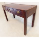 A brass mounted side table with three frieze drawers with military-style recessed brass handles,