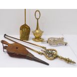 Four fireside tools and a brass doorstop: brass trivet, shovel and tongs; oak bellows; the