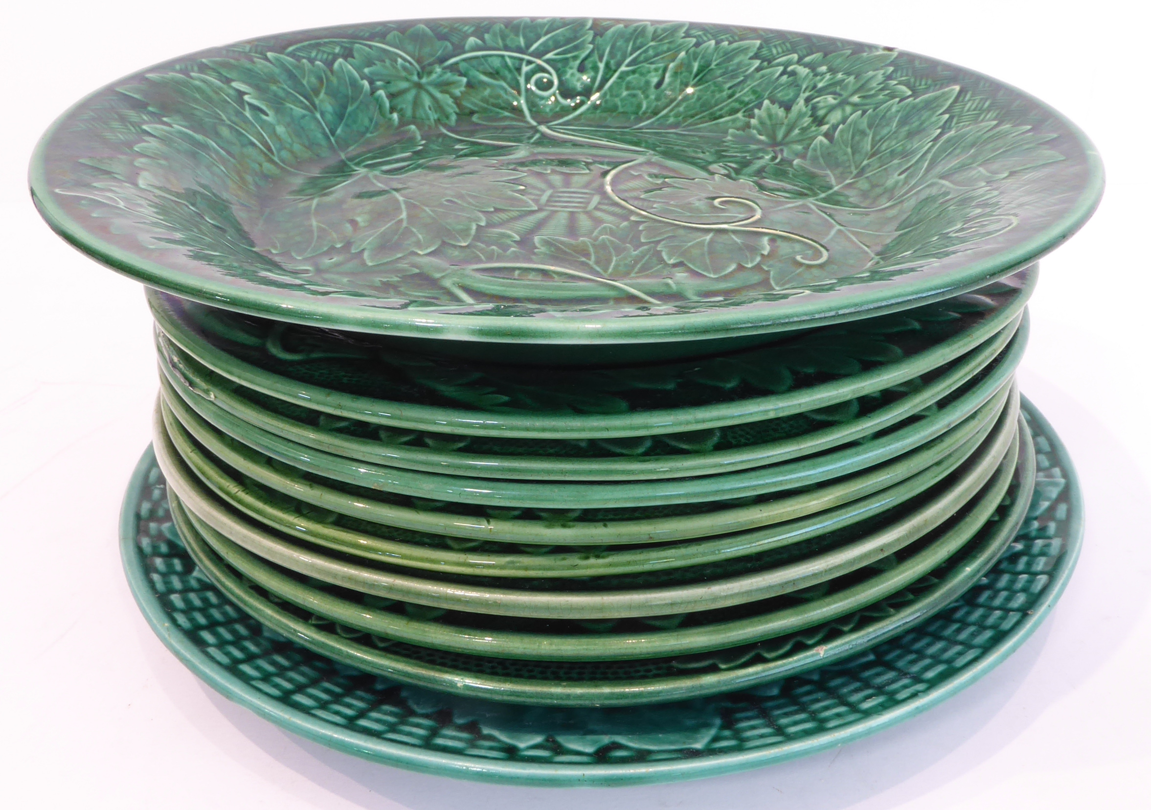 Nine 19th century green vine leaf majolica plates (19 cm) and a Wedgwood green vine leaf bowl with