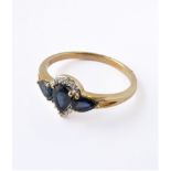 A lady's yellow gold (marked '375') dress ring: centrally set with an inverted pear-shaped hand-