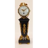 A fine French Empire ebony and ormolu clock