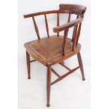 An early 20th century captain's style desk chair