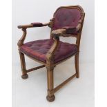 A fine and unusual mid-19th century desk-style walnut chair: open-armed and with red-leather