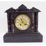 A late 19th century black slate and marble eight-day mantle clock; the cream chapter ring with