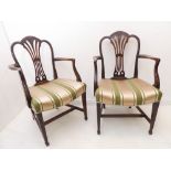 A pair of Hepplewhite-style (reproduction) open armchairs: pierced splats, shaped arms, satin-