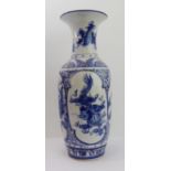 A large Oriental ceramic vase painted with dragons and palmettes above a lotus lappet border (60