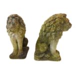 A good pair of stoneware garden lions: each seated four-square and with long flowing mane. (61 cm