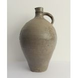 A large 19th century continental salt glaze stoneware flagon: the front incised with a stylised blue