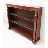An early 20th century mahogany Egyptian Revival open bookcase: two shelves (not adjustable)