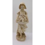 An early 20th century plaster model of a young girl (50 cm high) carrying three puppies in a