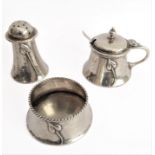 A three-piece hallmarked silver cruet set in high Art Nouveau style. Each piece with planished