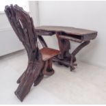 A highly unusual and striking driftwood-style desk and matching chair. The figured top above a