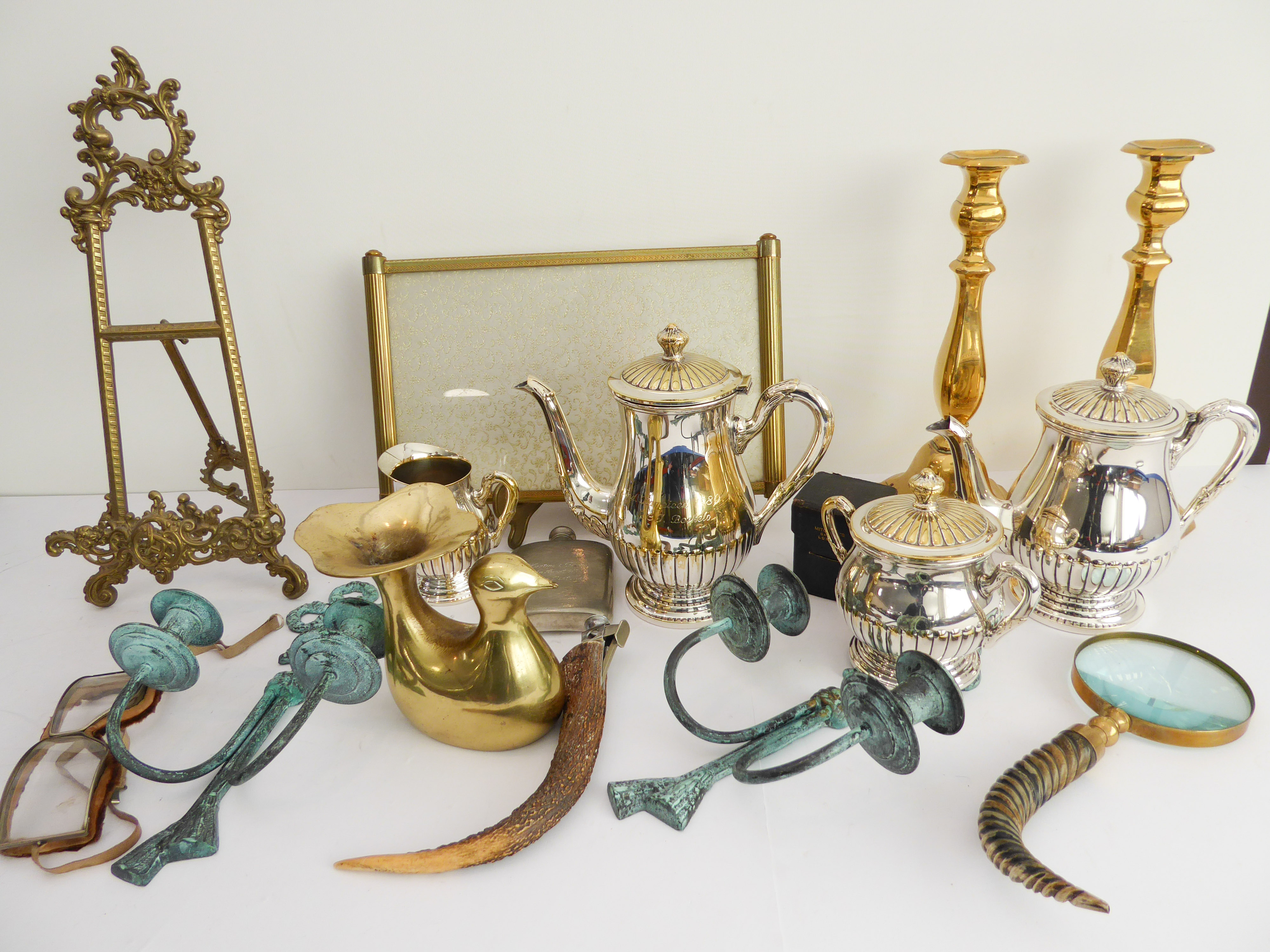 A selection of decorative ornamental metalware to include: a 40 cm easel; a pair of brass