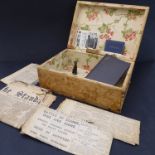A 19th century pine box (pasted with wallpaper) and its contents to include: a small autograph